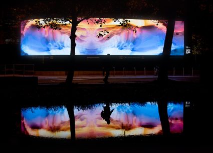 Perpetual Now II, installation by Scott Eaton, large outdoor screen, reflecting in water